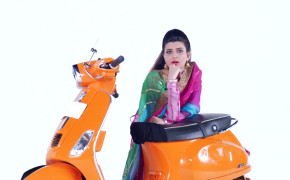 Nimrat Khaira Orange Scooter 03358