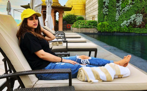 Sunanda Sharma Resting on Pool Wallpaper 37298